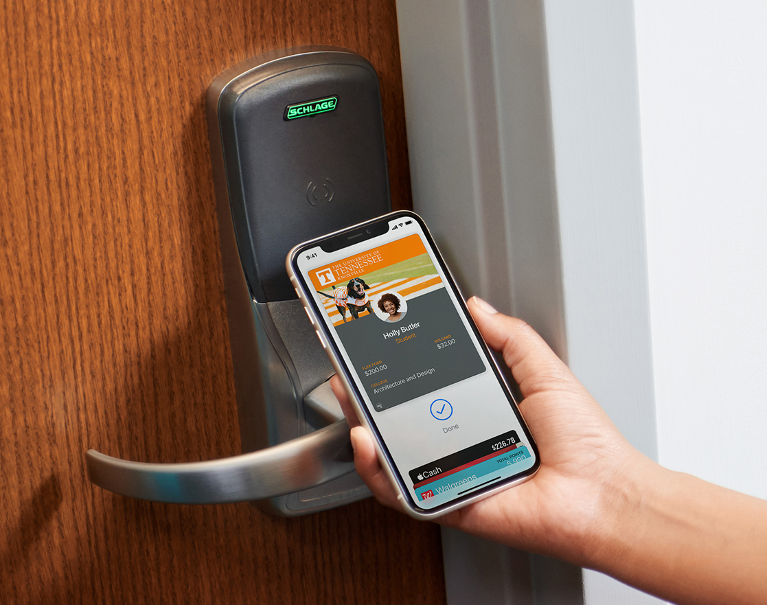 Student unlocking door with mobile phone